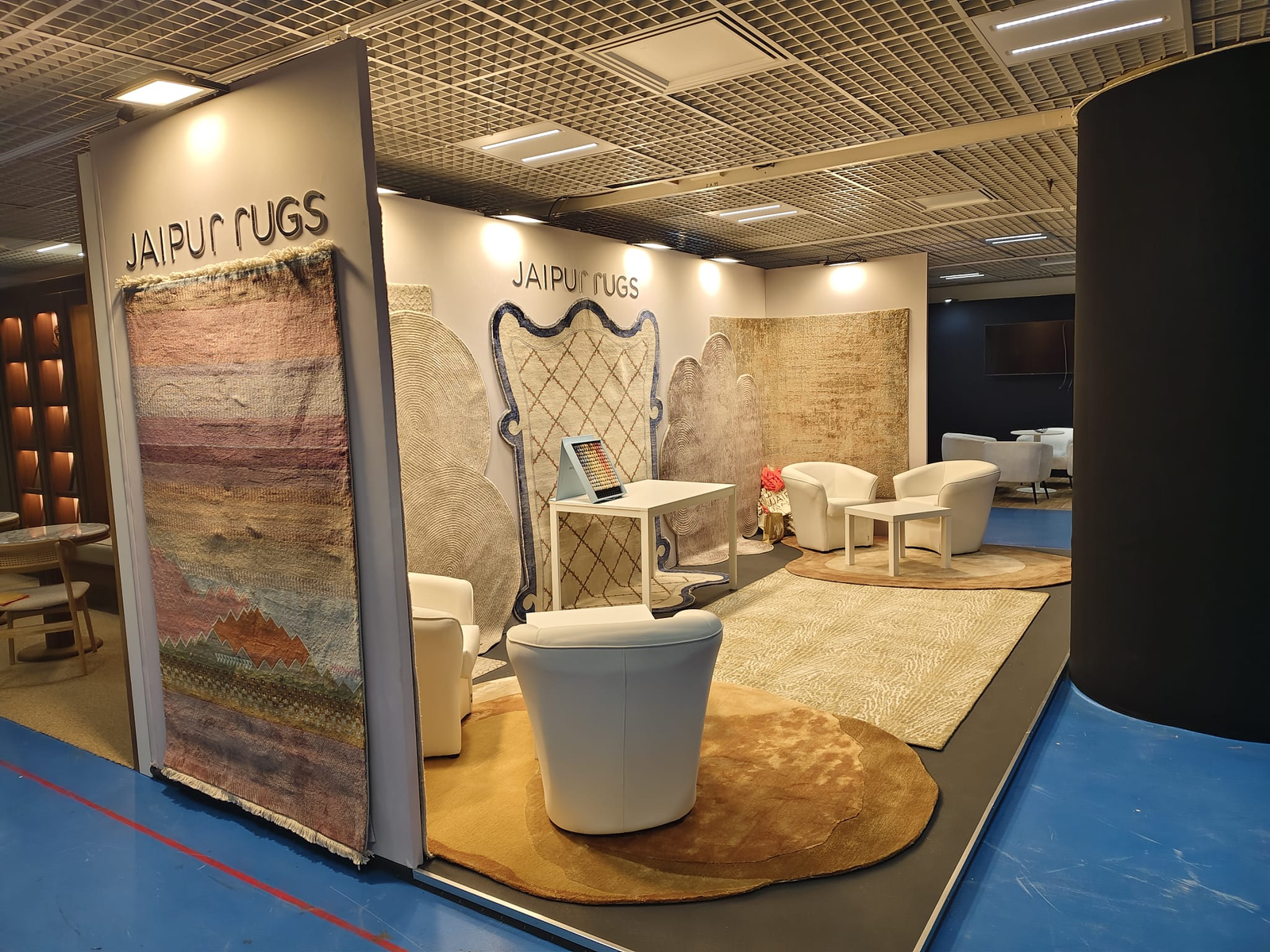 Jaipur Rugs exhibition booth at IDEM 2025 by Booth Fabricators